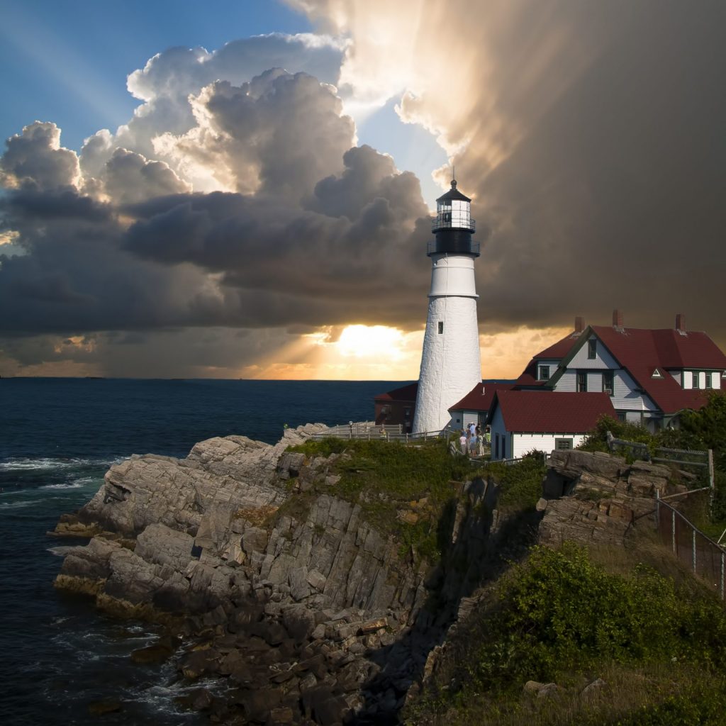 A lighthouse with some houses whatsapp dp image