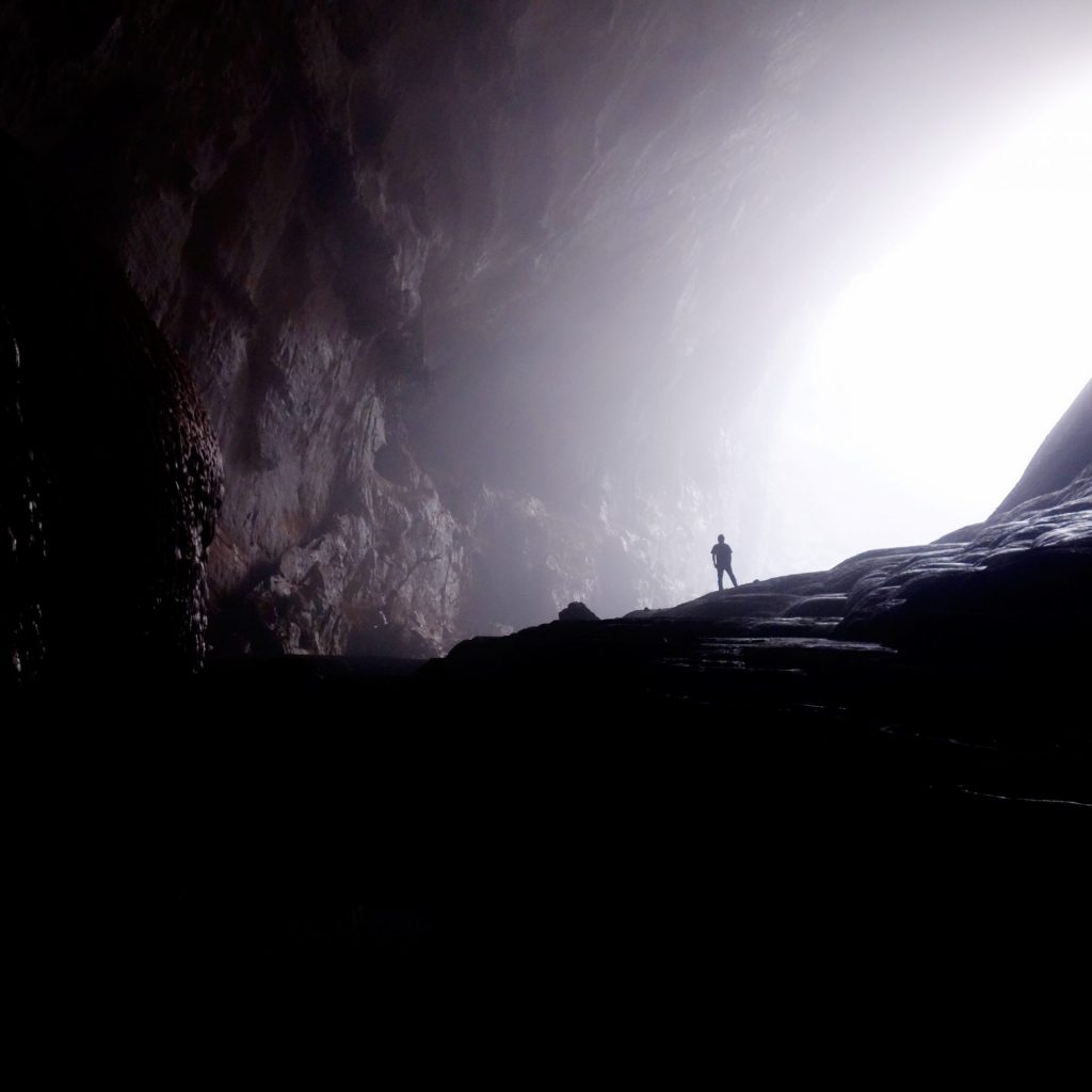 A man enjoy sunlight in the dark cave whatsapp dp image