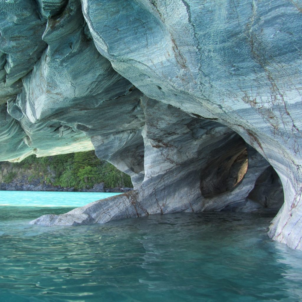 A marble cave with blue water lake whatsapp dp image