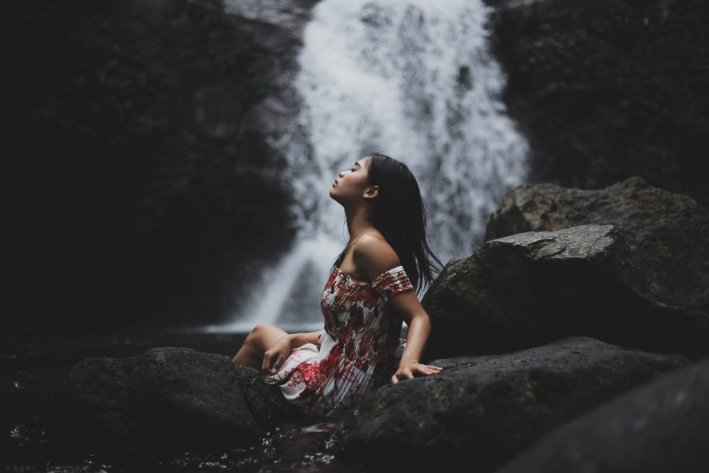 Girl enjoys waterfall whatsapp dp image