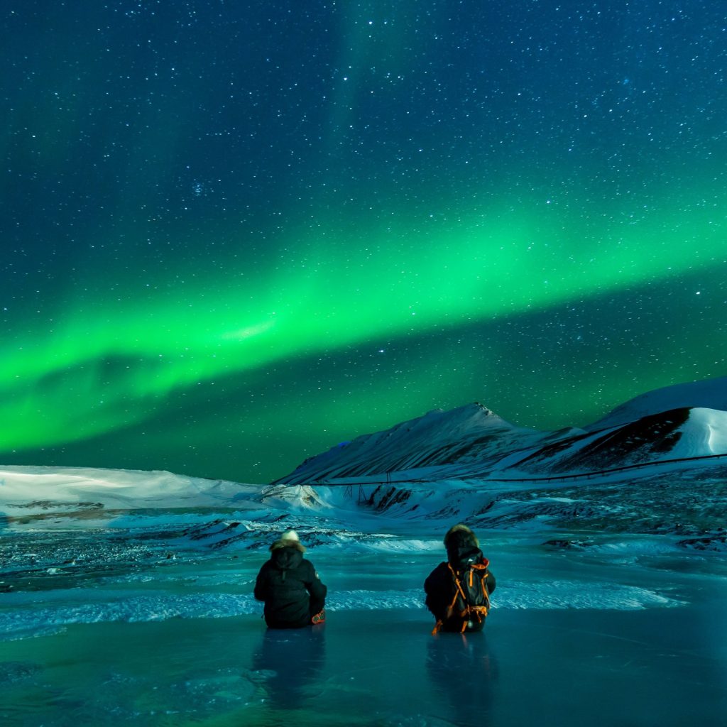 Two people enjoy night view icelands