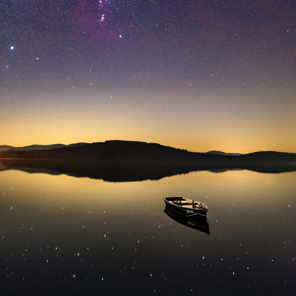 A Boat In The Lake With Stars Night whatsapp Dp Image