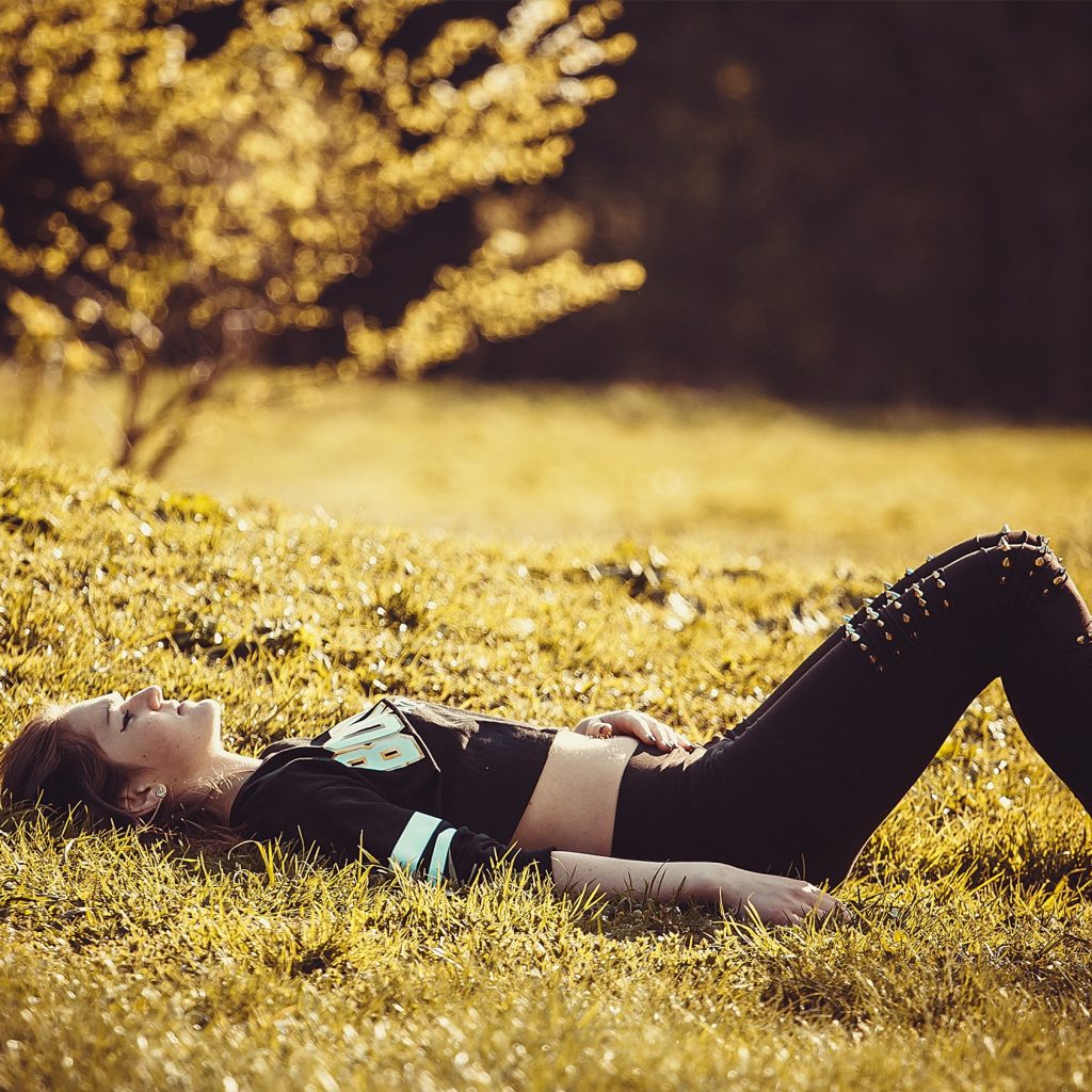 A Girl lying On The Grass Whatsapp Dp Image