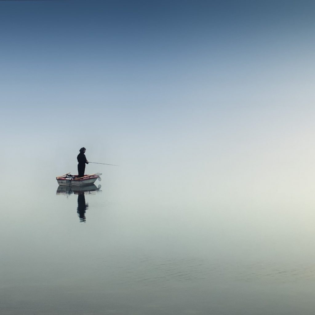 A Man Fishing In The Ocean Water Whatsapp Dp Image