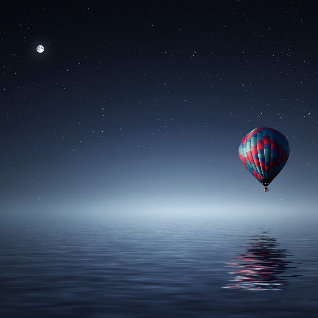 A hot air balloon flying in moonlight whatsapp dp image