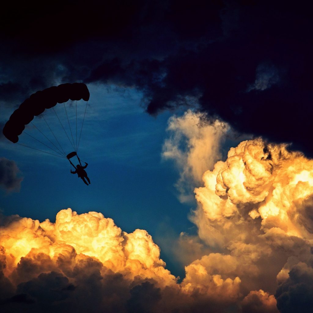 A parachute man enjoy sunset clouds whatsapp dp image