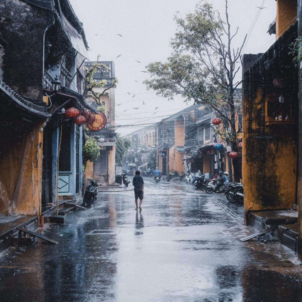 A person go to home in the rain whatsapp dp image