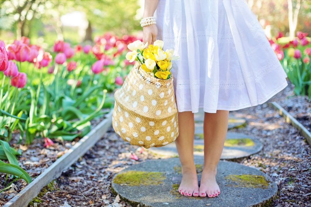 In The Spring Season A Child Holding Flowers Basket In The Park Whatsapp Dp Image