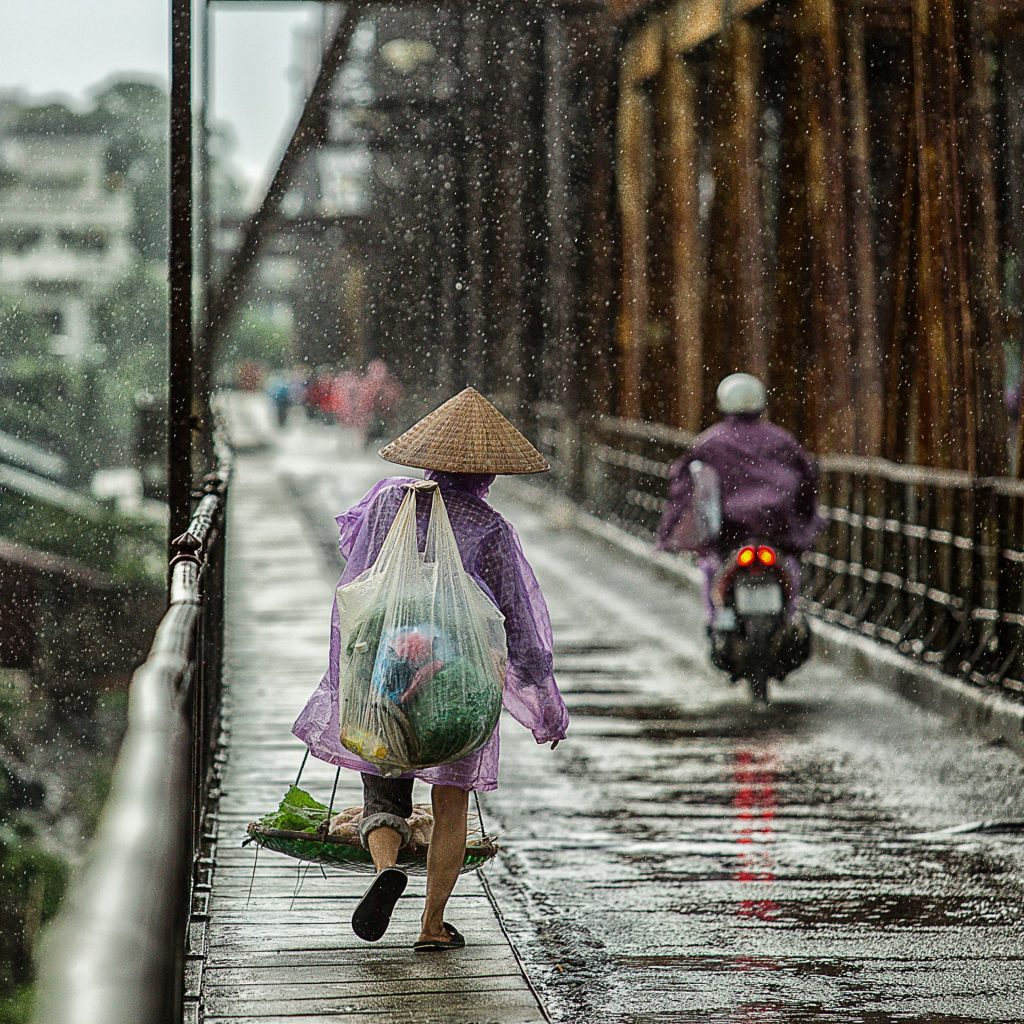People walking on the street in the rainy season whatsapp dp image