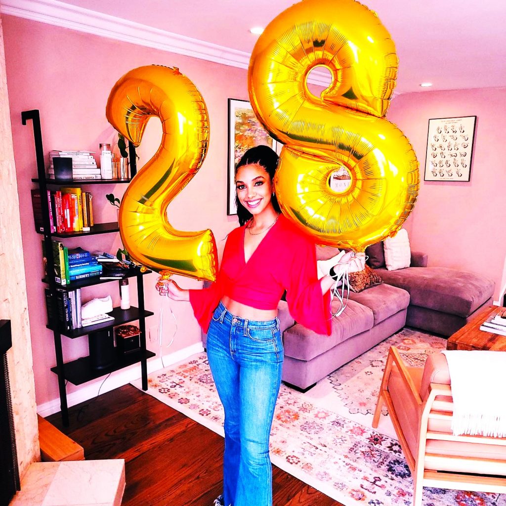 Corinne Foxx Holding Number Balloons WhatsApp DP Image