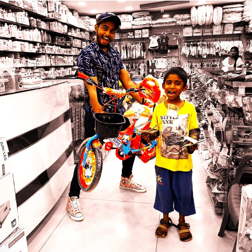 Harsha Sai Gift A Cycle To Child WhatsApp DP Image
