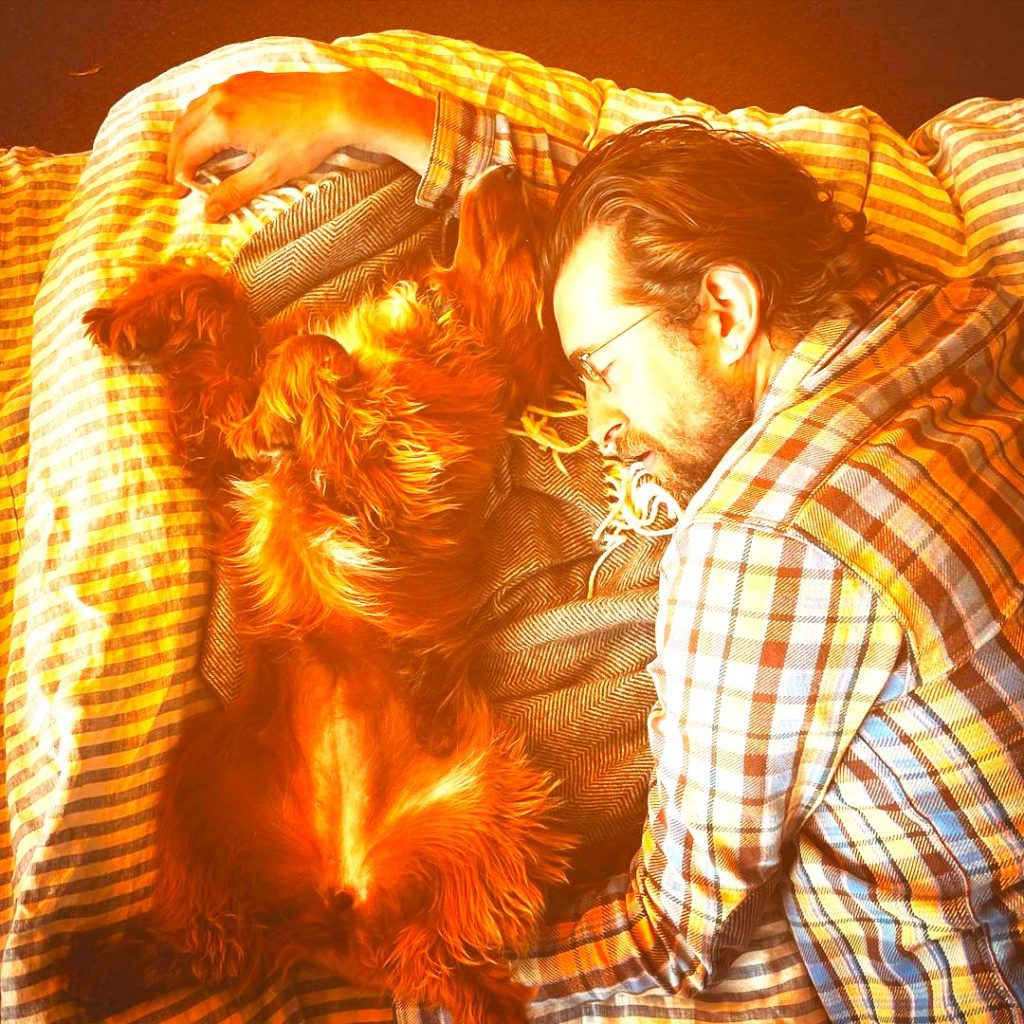 Christopher Chapman Sleeping With Pet WhatsApp DP Image