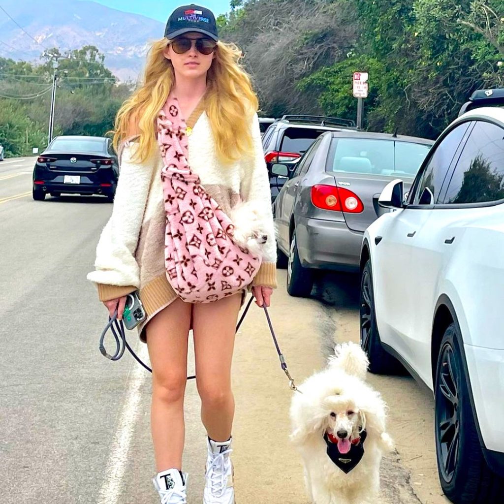 Kathryn Newton And His Pet Walking On The Road WhatsApp DP Image