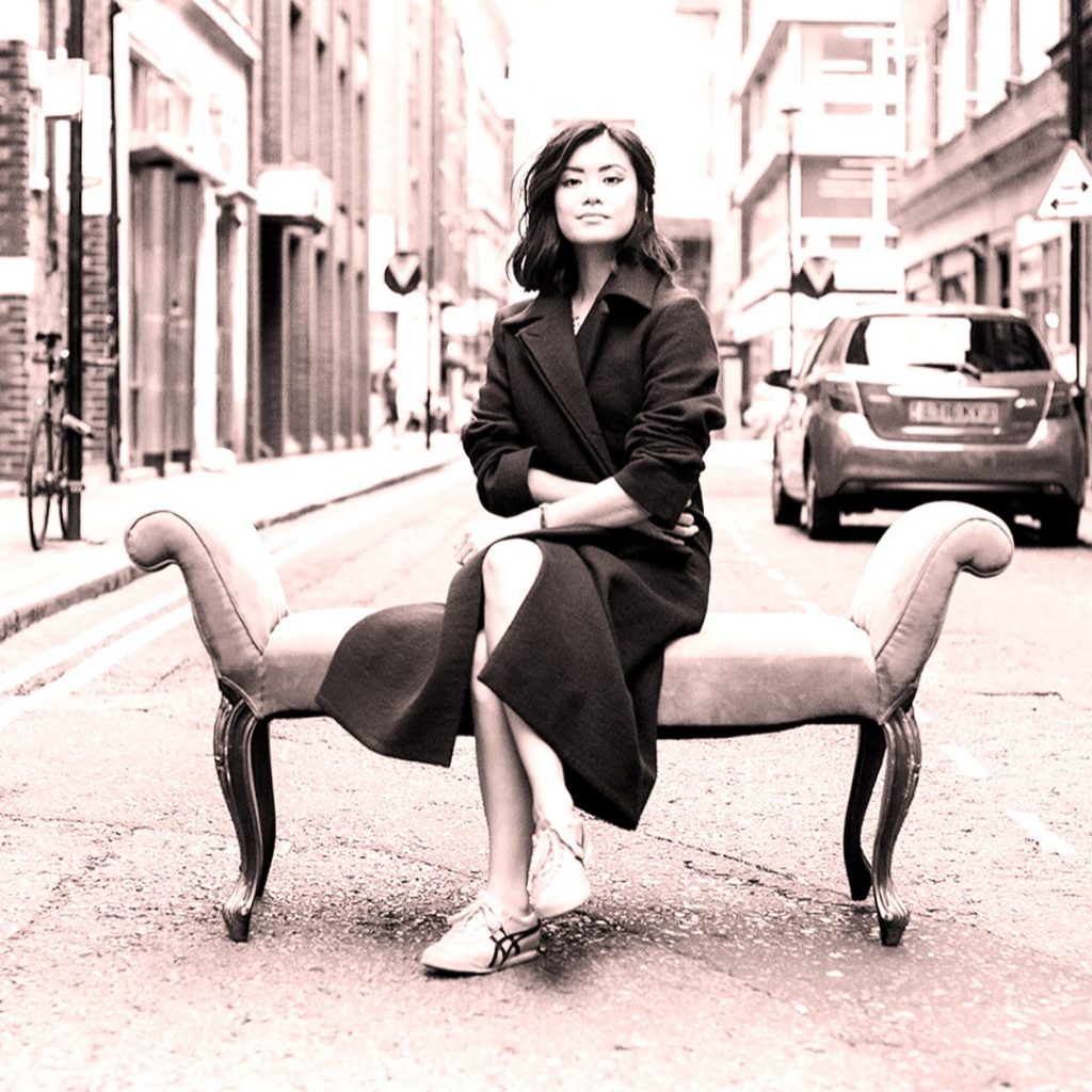 Katie Leung Seating On A Chair WhatsApp DP Image